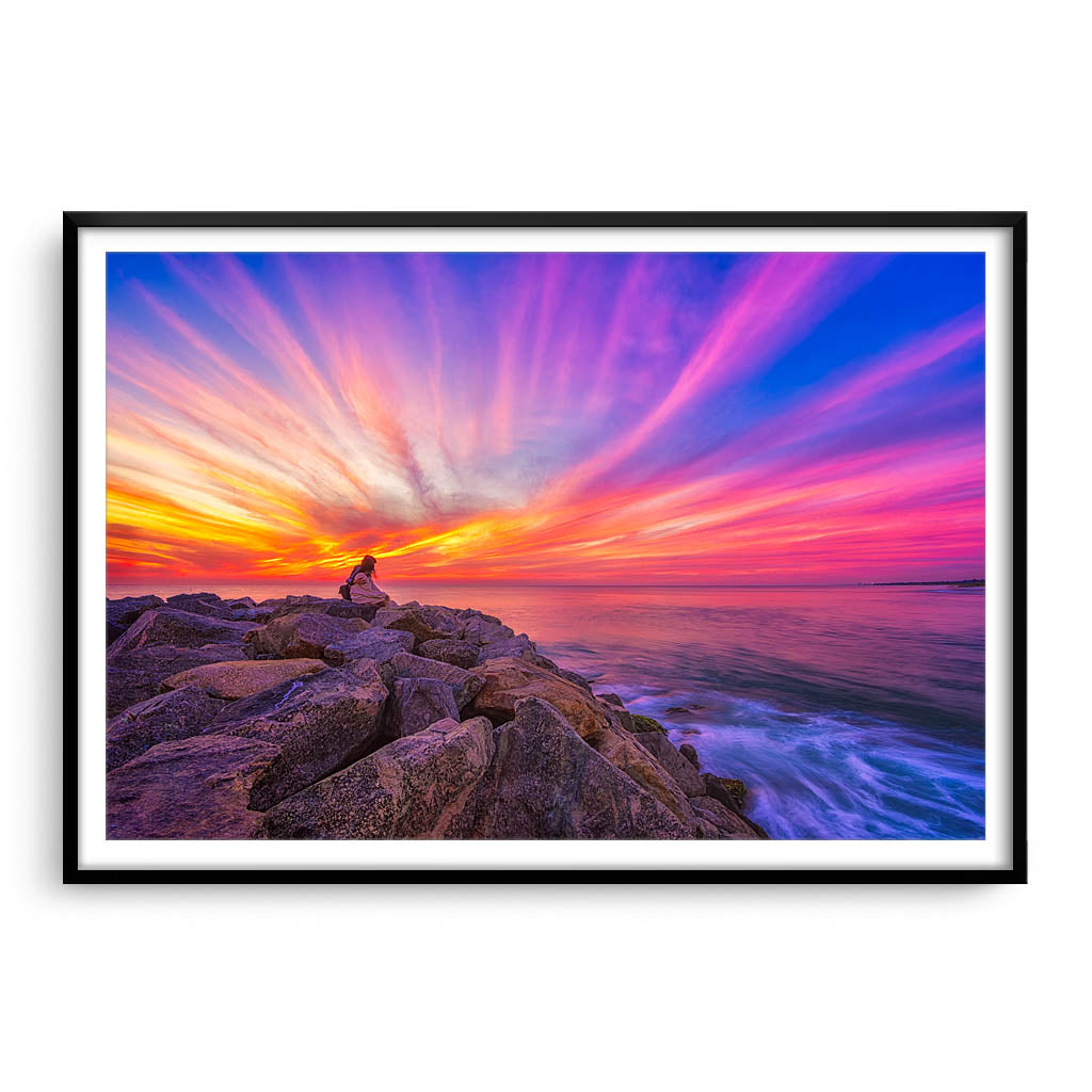 Couple watching the sunset at Cottesloe Beach in Perth, Western Australia framed in black
