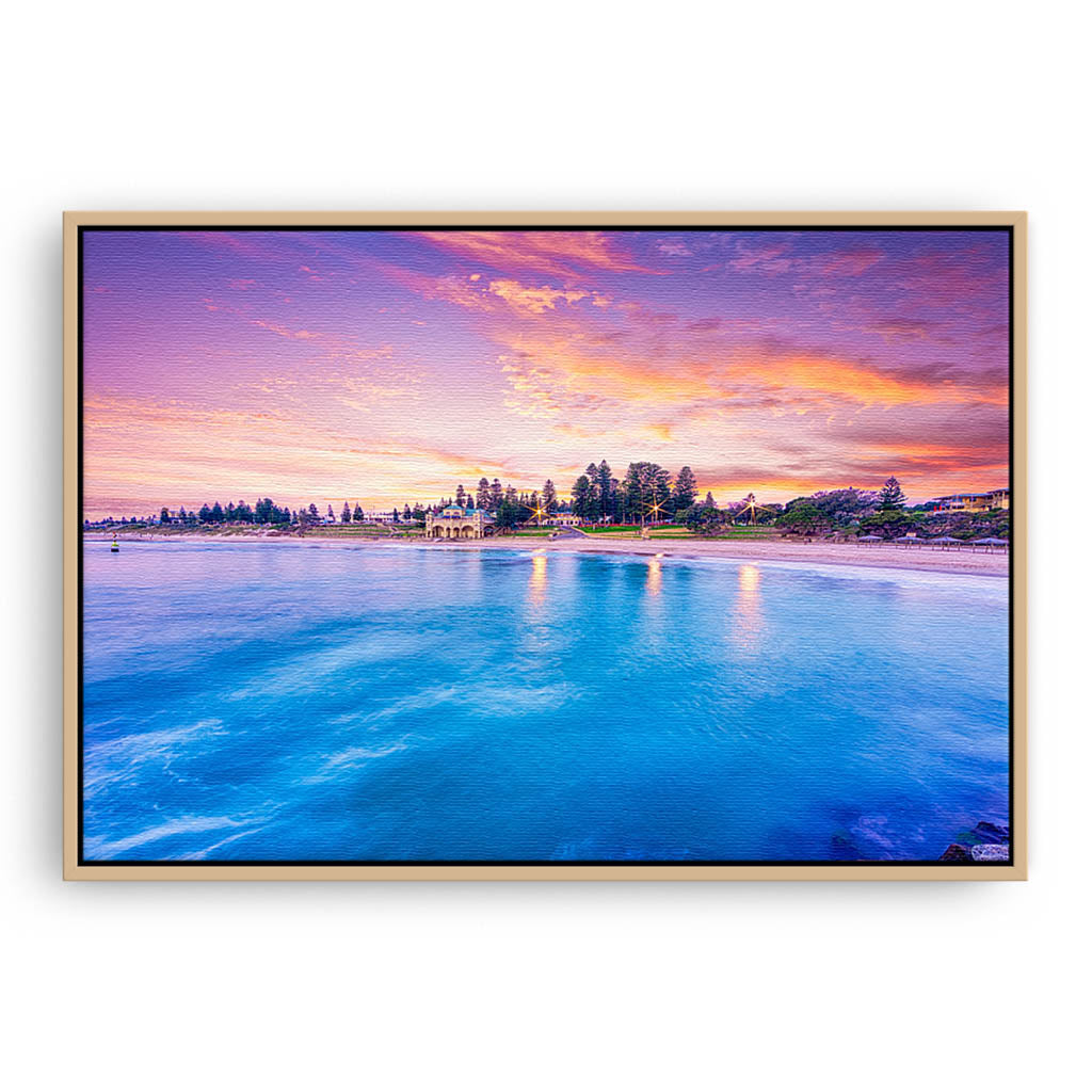 Blue waters and magenta skies over Cottesloe in Perth, Western Australia framed canvas in raw oak