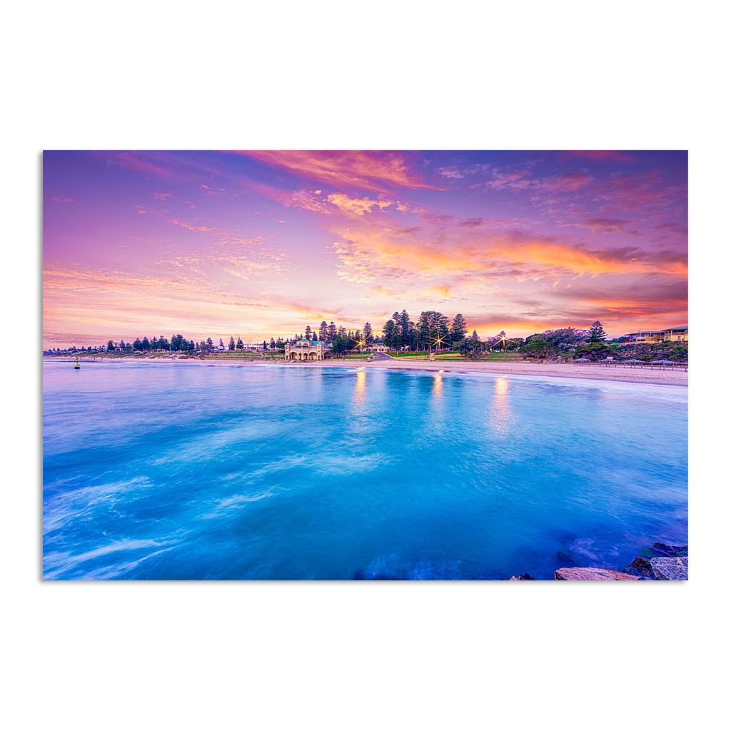 Blue waters and magenta skies over Cottesloe in Perth, Western Australia