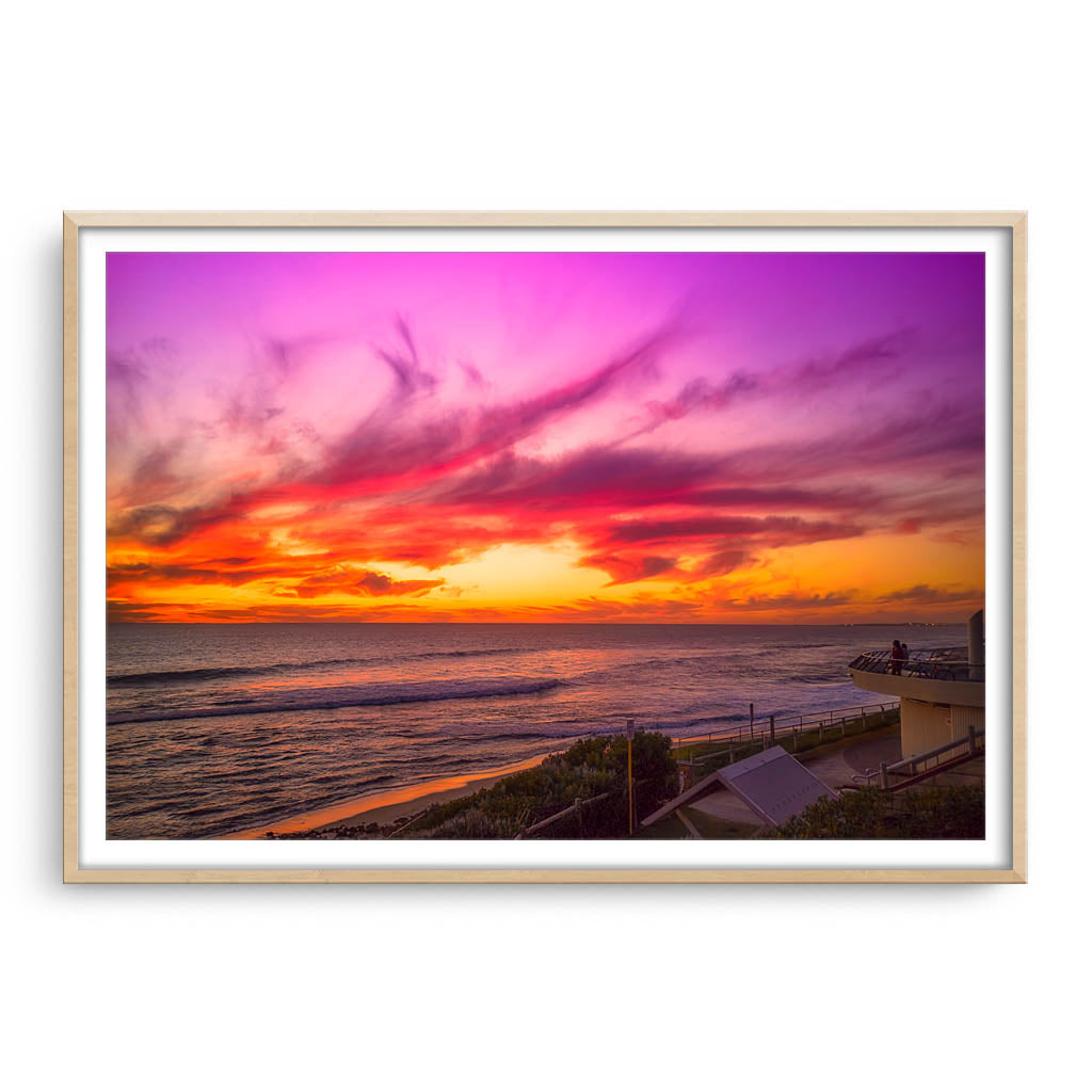 Sunset over Mettams Pool in Perth, Western Australia framed in raw oak