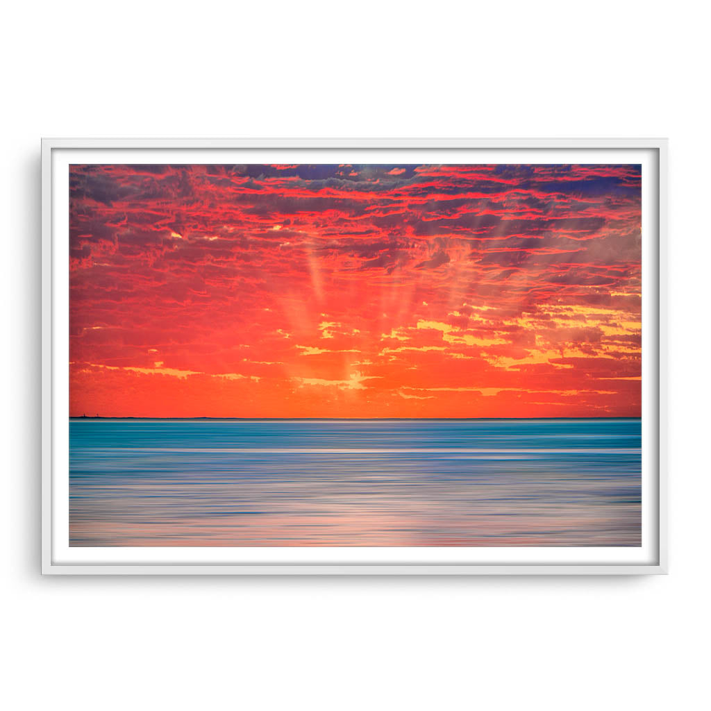 Sun rays over Scarborough Beach in Perth, Western Australia framed in white