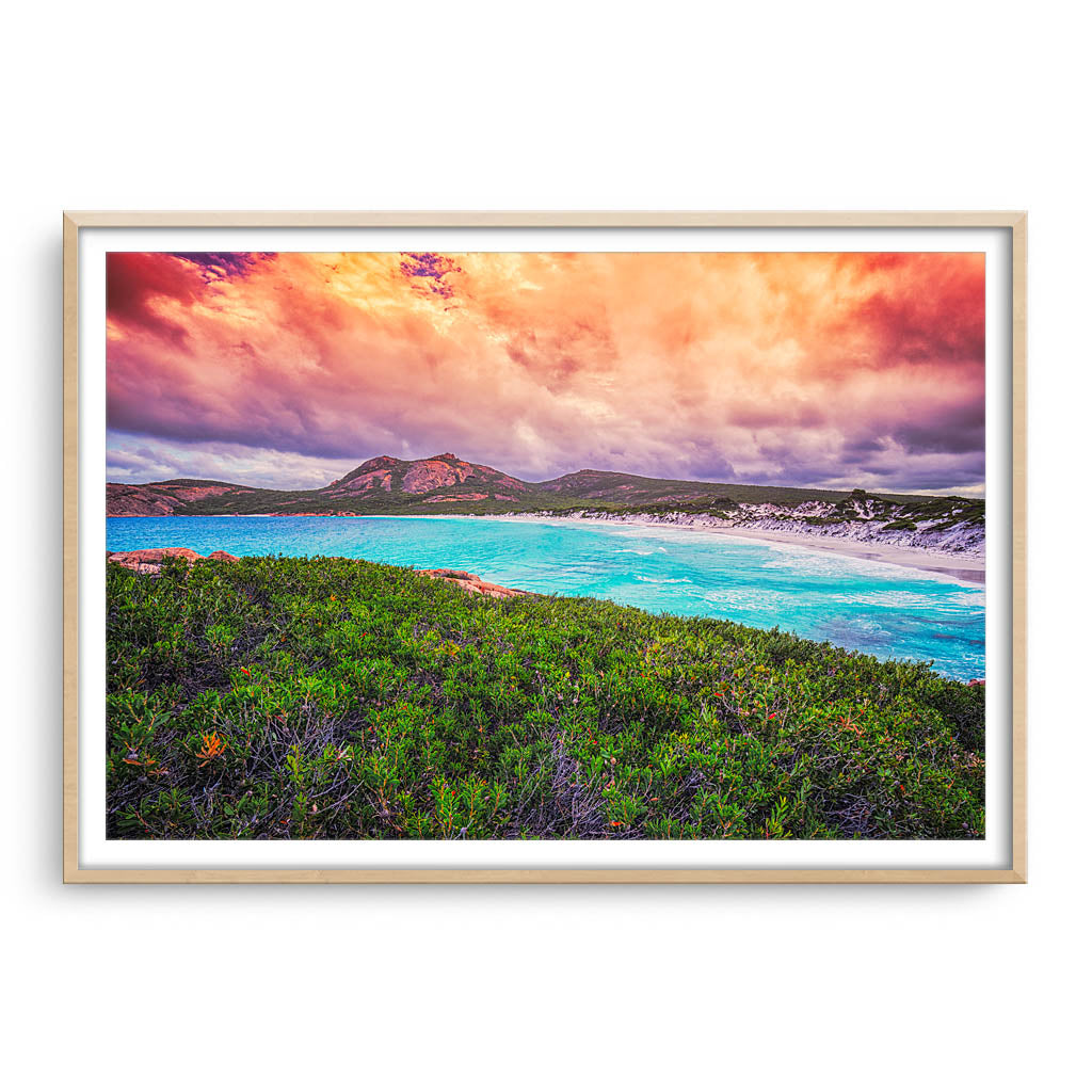 Cloudy skies over Hellfire Bay in Esperance, Western Australia framed in raw oak