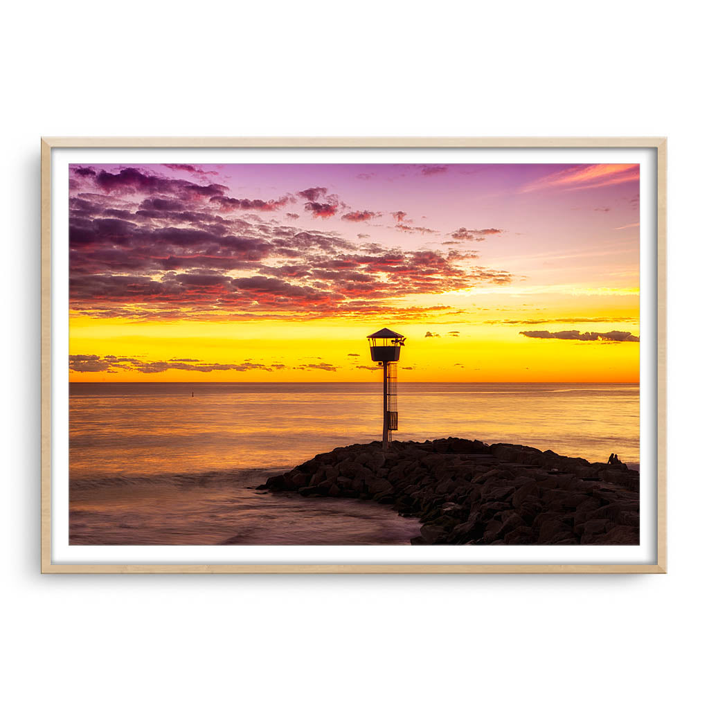winter sunset at city beach in Perth, Western Australia framed in raw oak