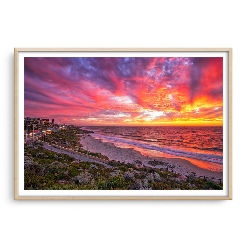 Stunning sunset over North Beach in Perth, Western Australia framed in raw oak