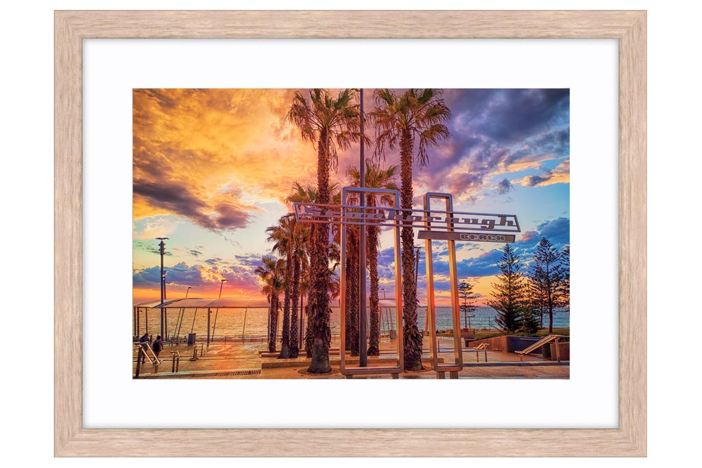 Stormy sunset at Scarborough Beach in Perth, Western Australia framed in raw oak