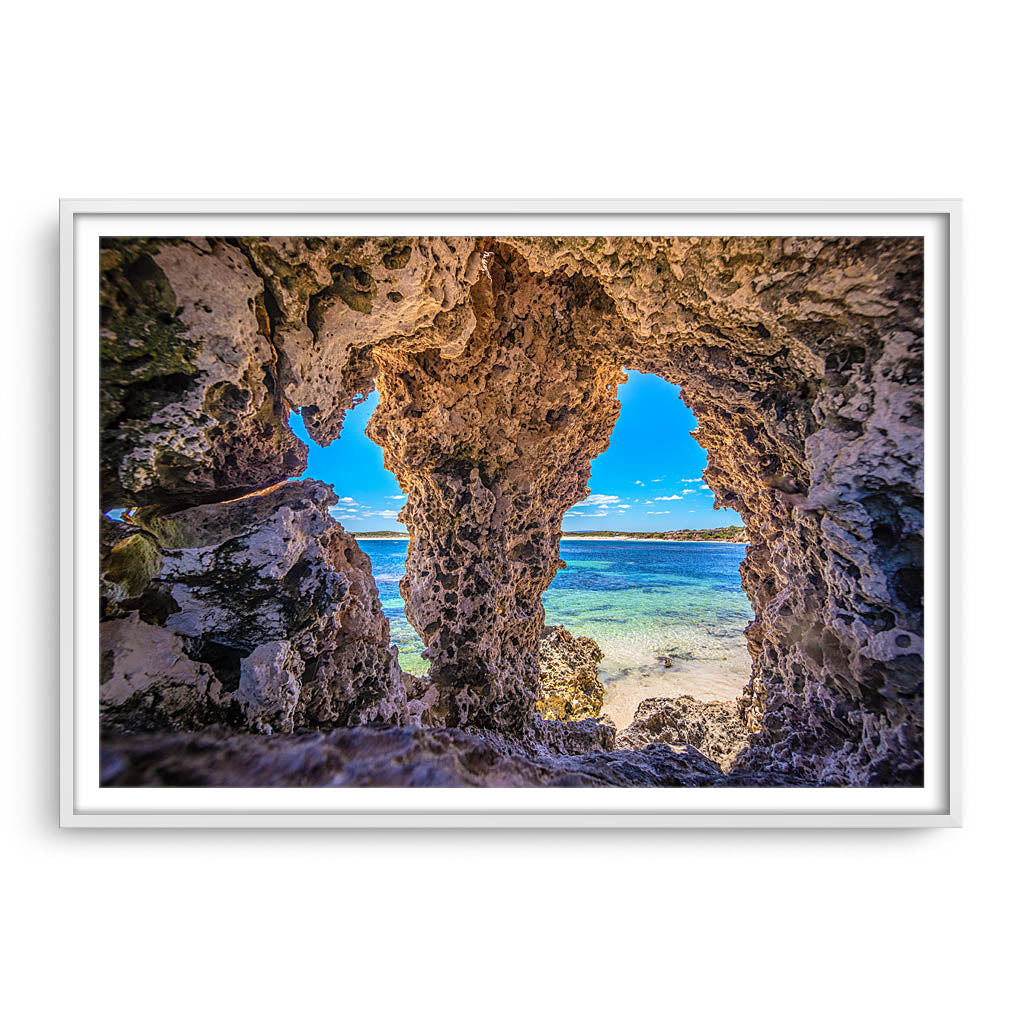 Natures windows at Sandy Cape in Western Australia framed in white