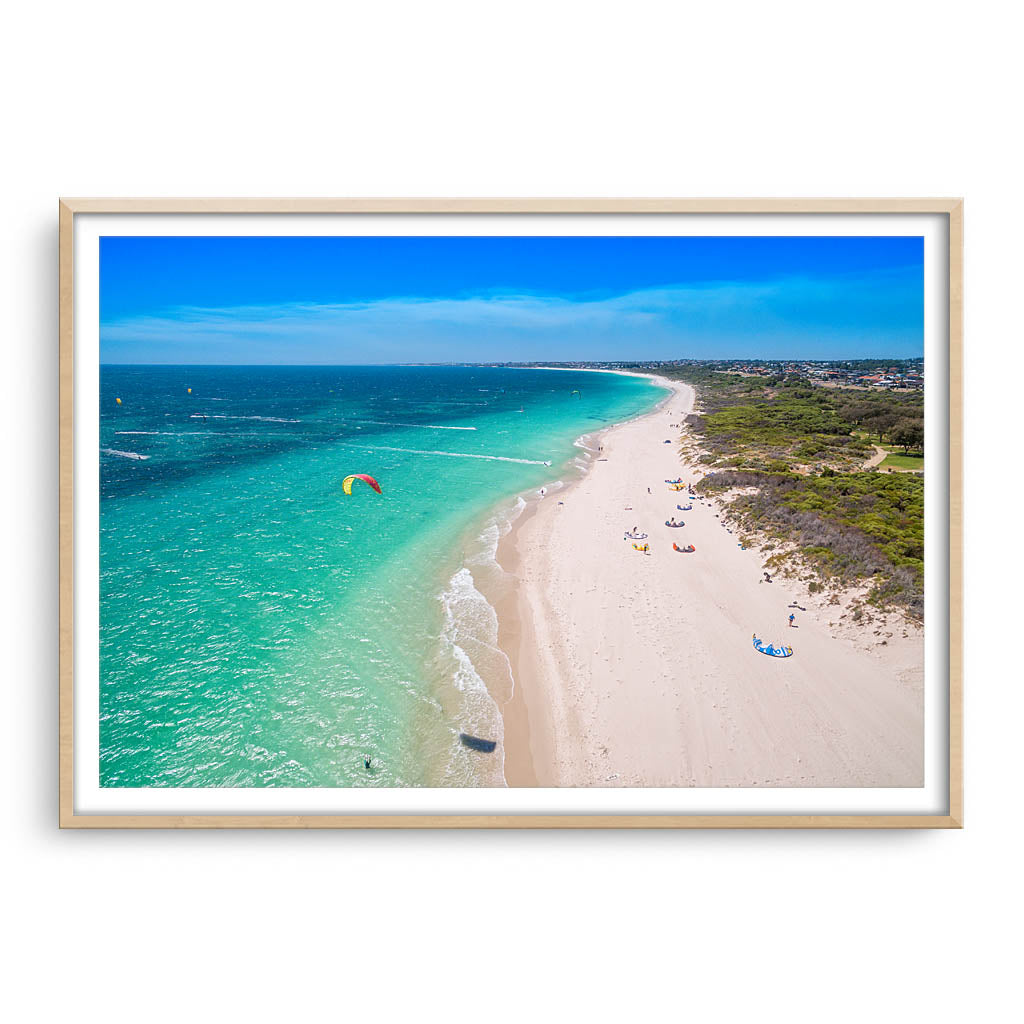 Aerial view of kitesurfers in Perth, Western Australia framed in raw oak