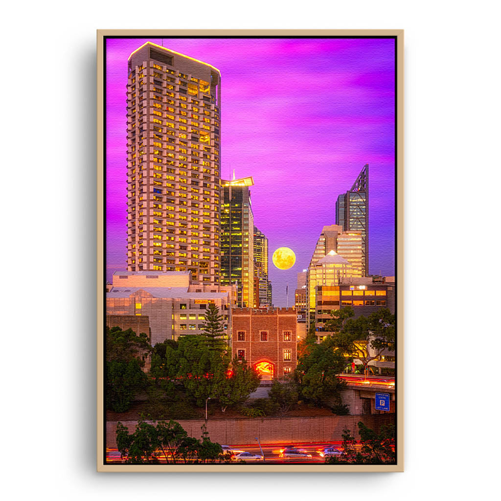 Moon rising through the city of Perth, Western Australia framed canvas in raw oak