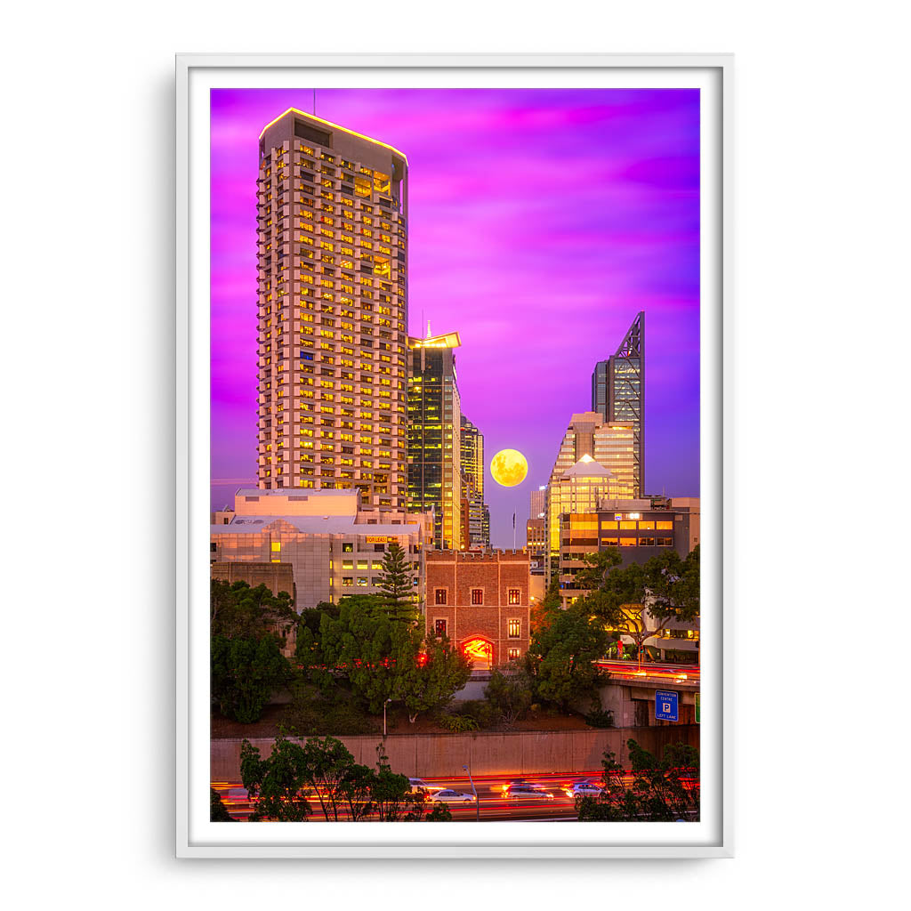 Moon rising through the city of Perth, Western Australia framed in white