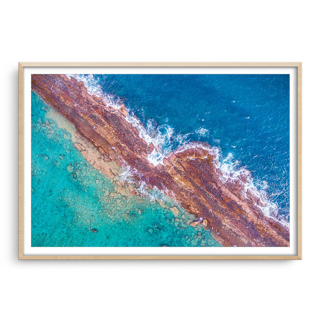 Abstract aerial of Port Gregory reefs in Western Australia framed in raw oak