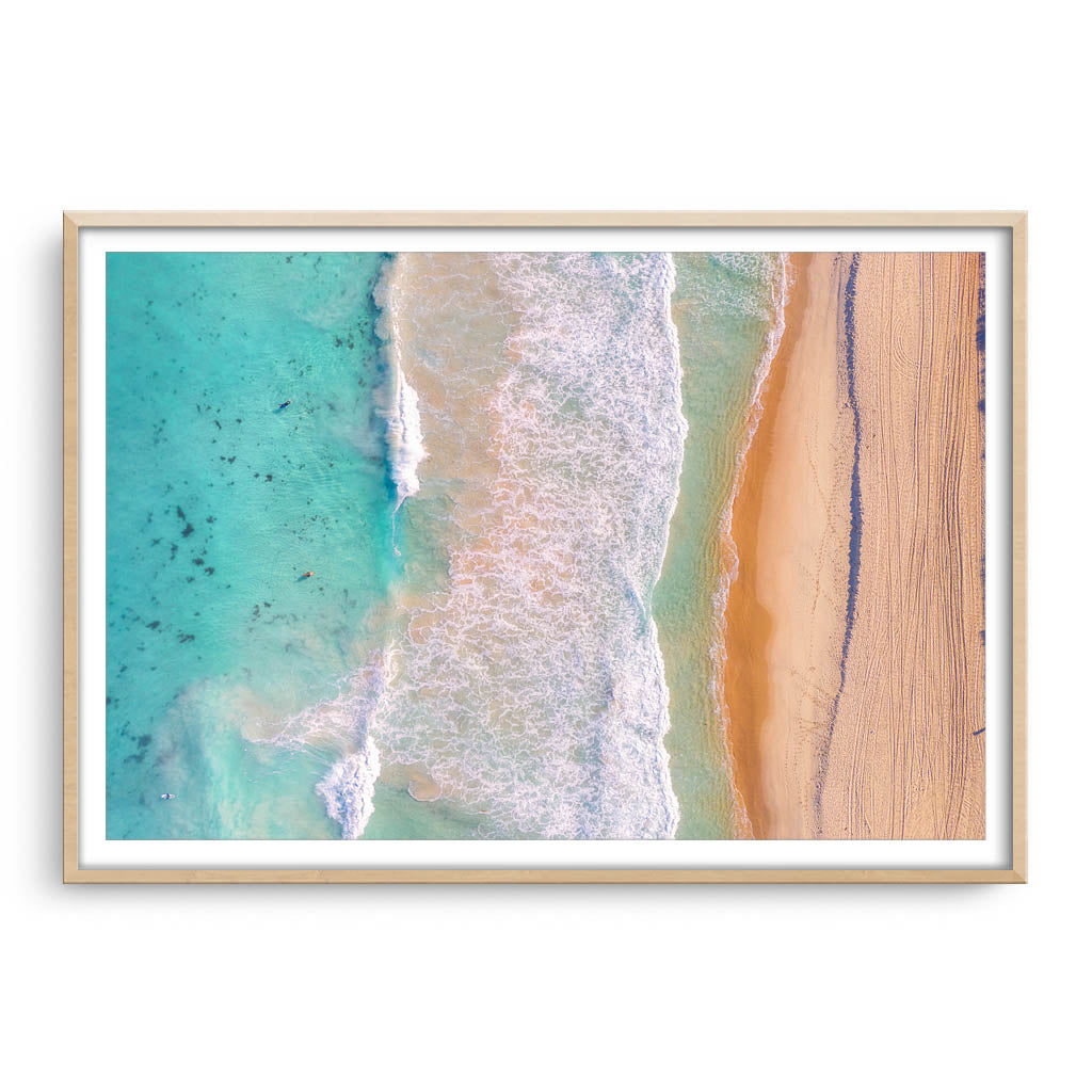 Aerial view of Trigg Beach in Perth, Western Australia framed in raw oak