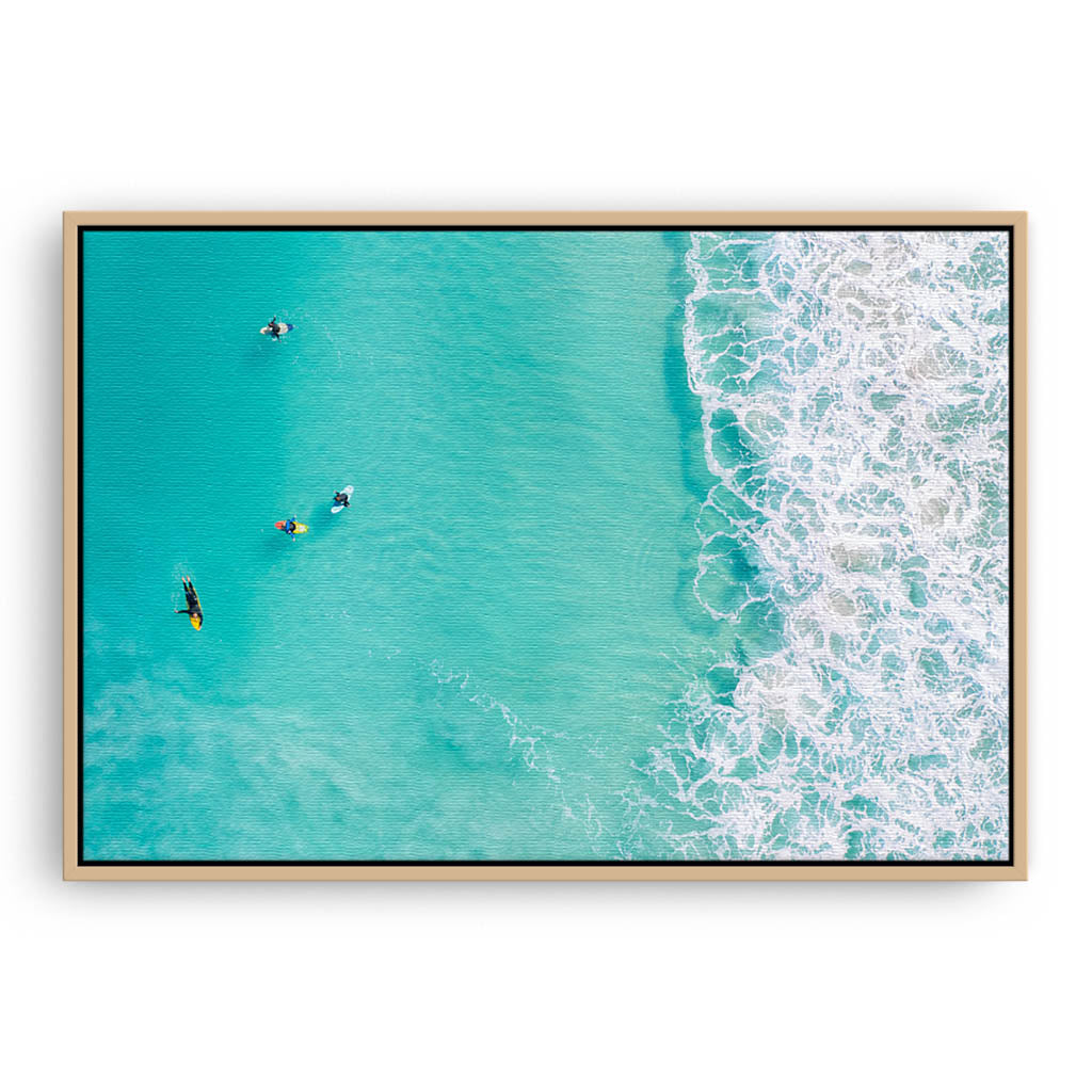 Surfers at Trigg Beach in Perth, Western Australia framed canvas in raw oak