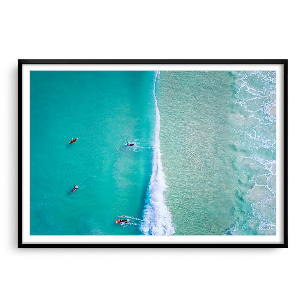 Aerial view of surfers at Trigg Beach in Perth, Western Australia framed in black