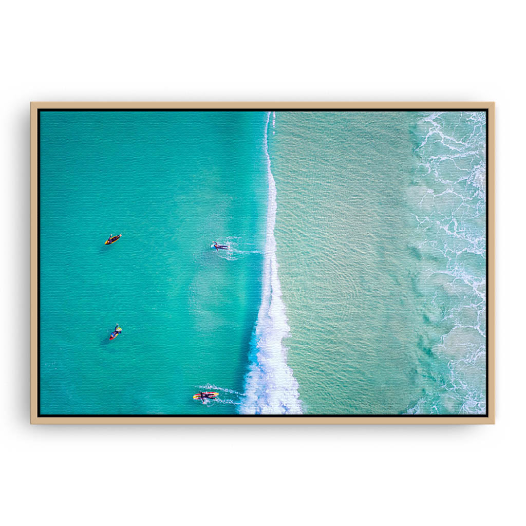 Aerial view of surfers at Trigg Beach in Perth, Western Australia framed canvas in raw oak