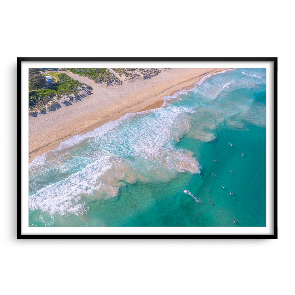 Aerial view of surfers at Trigg Beach in Perth, Western Australia framed in black