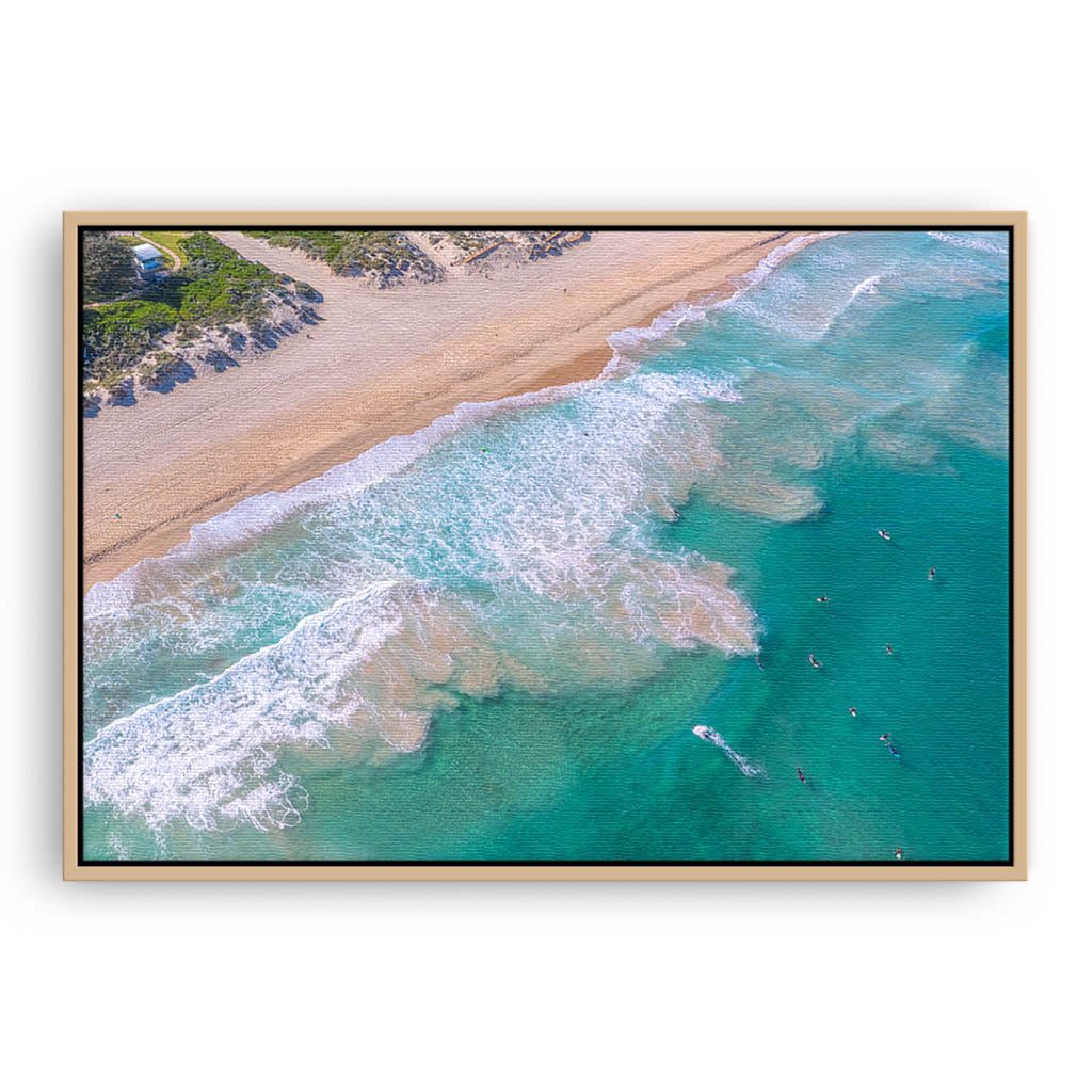 Aerial view of surfers at Trigg Beach in Perth, Western Australia framed canvas in raw oak