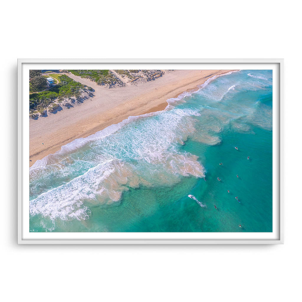 Aerial view of surfers at Trigg Beach in Perth, Western Australia framed in white