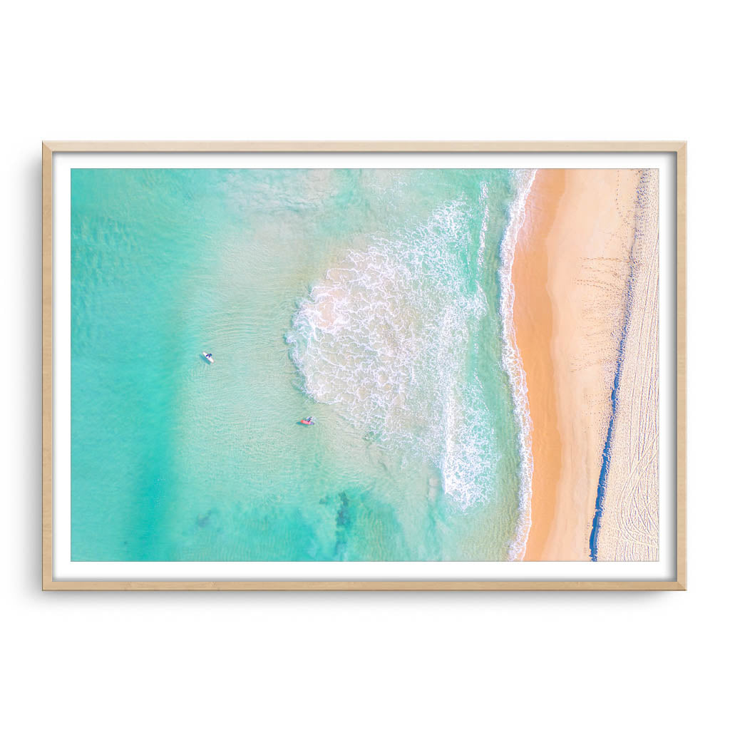 Aerial view of Trigg Beach in Perth, Western Australia framed in raw oak