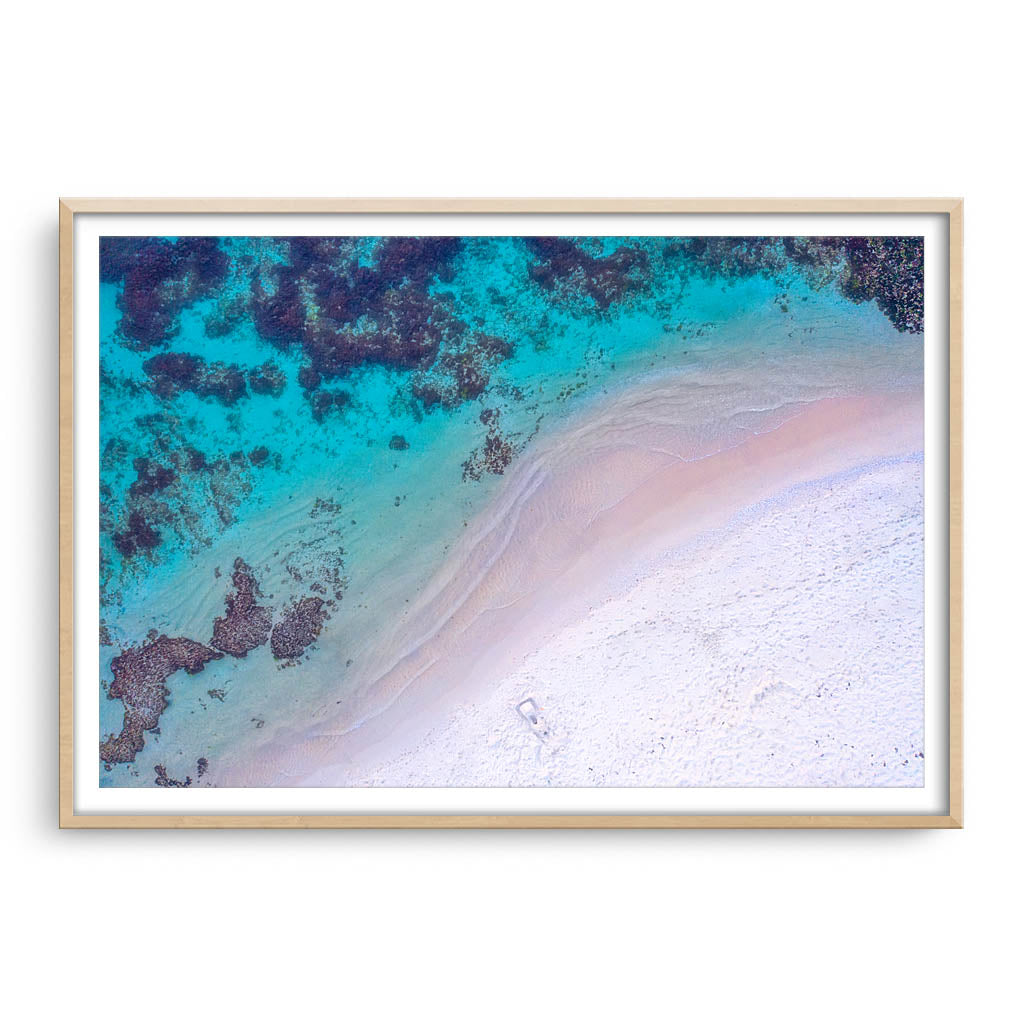 Aerial view of Mettams Beach in Perth, Western Australia framed in raw oak