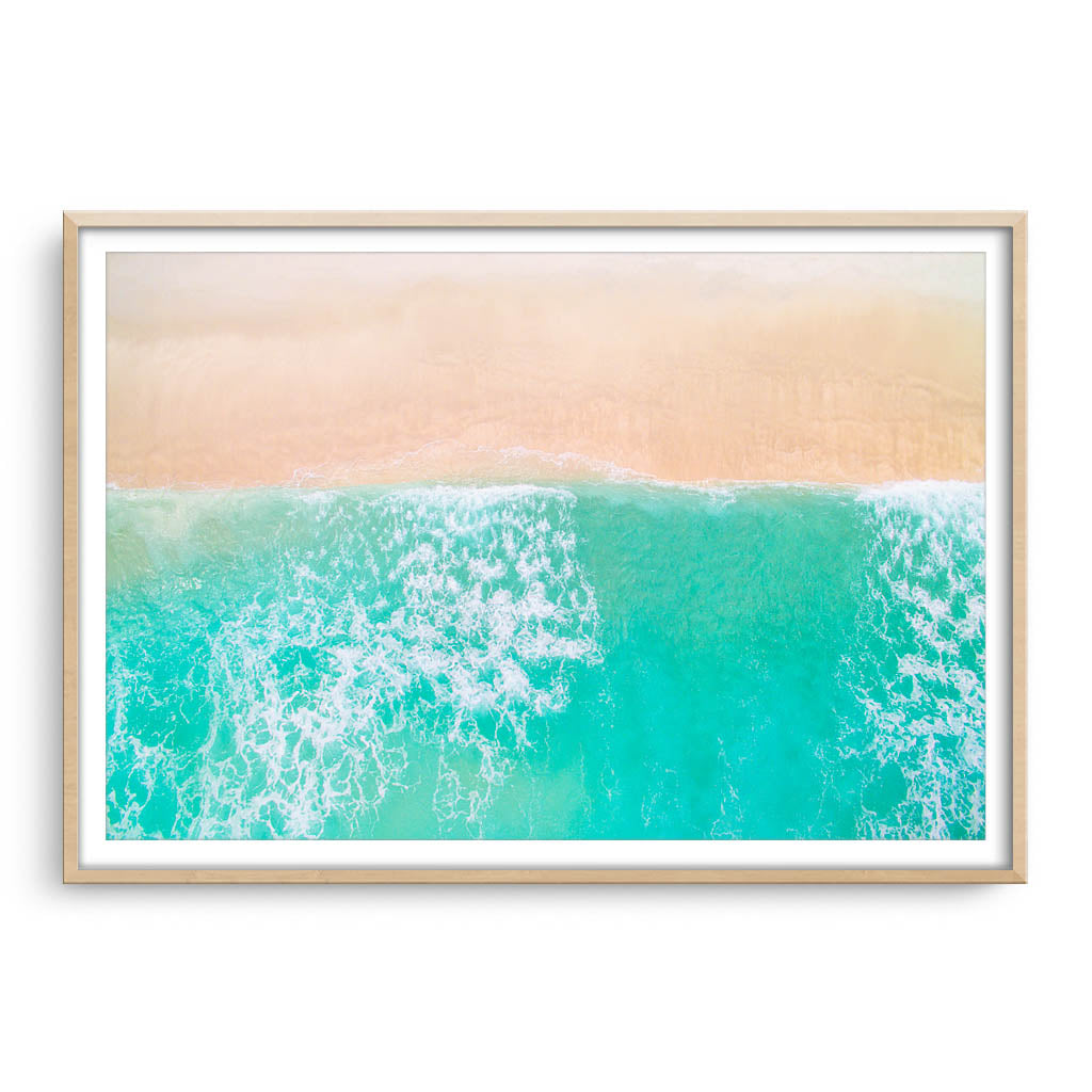 Aerial view of Trigg Beach in Perth, Western Australia framed in raw oak