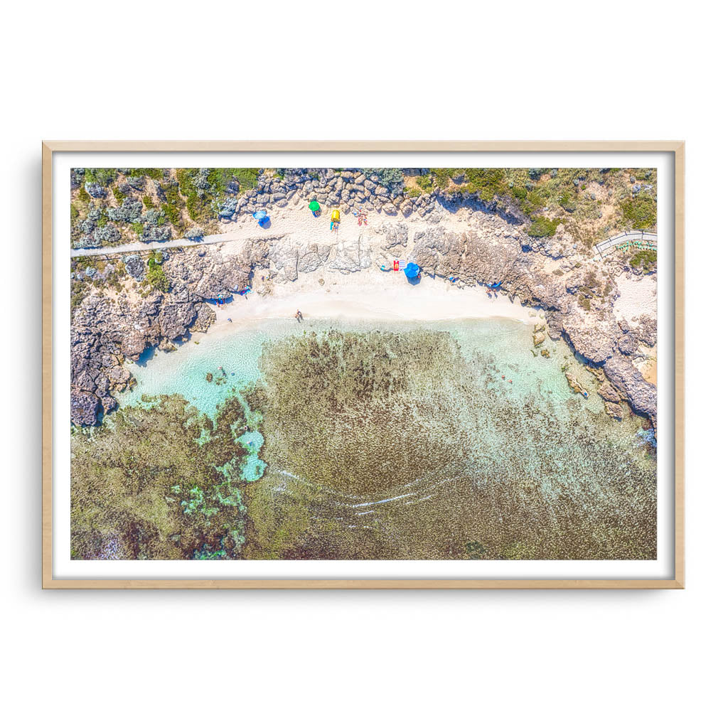 Aerial view of Mettams Pool in Perth, Western Australia framed in raw oak