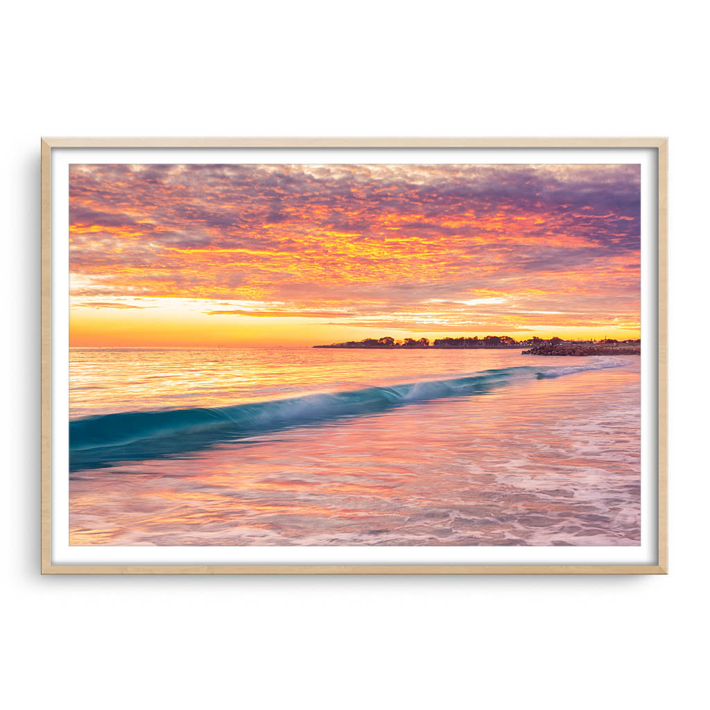 Winter sunset over Sorrento Beach in Perth, Western Australia framed in raw oak